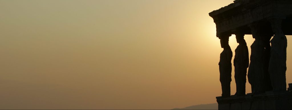 The sculptures of Kariatides of Erechthion temple is seen during the sunset in the Acropolis.