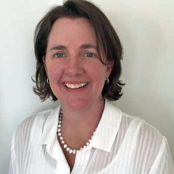 Image of Mary McBryde looking at camera, wearing a white blouse and blue blazer. Mary is the Director of Investment and Innovation and helps lead the Cool Capital Stack Initiative.