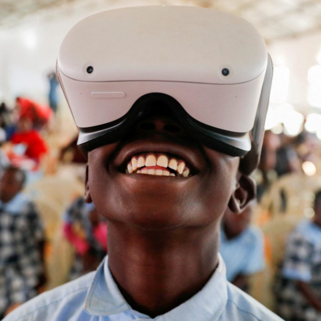 Image of young boy wearing VR headset looking up.